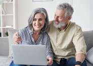 Older couple looking at laptop together